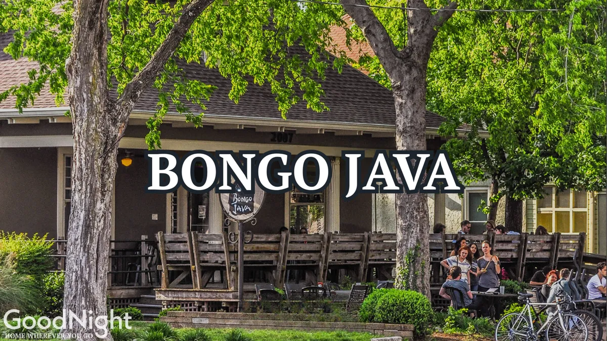 The exterior of Bongo Java café, featuring its iconic sign, an inviting outdoor seating area, and greenery that creates a relaxed, local vibe. The scene suggests a blend of productivity and leisure, with space for guests to enjoy coffee, people-watch, or take a break from work.